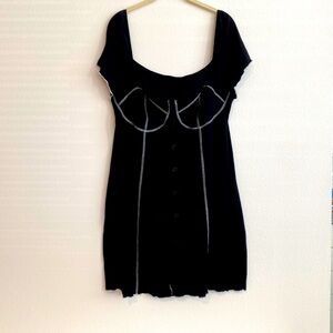 Black mini dress with white stitching